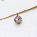 Macro shot of a purple cubic zirconia stone wrapped in gold geometric metal frame - Small / Lavender