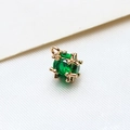 Macro shot of green faceted zircon pendant in gold-plated pixel style hollow cage frame - Small / Green
