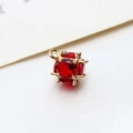 Detailed macro view of a red faceted cubic zircon pendant with gold plated claw setting - Large / Red