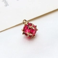 Macro shot of a red gemstone pendant with gold-plated criss-cross metal claw for DIY jewelry - Large / Rose Red
