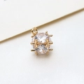 Detailed close-up of a gold-plated copper pendant with clear cubic zirconia pavé stones - Large / White