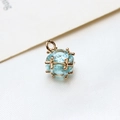 Macro detail of a light blue zircon cube pendant with 18k gold plated claw setting - Large / Light Blue