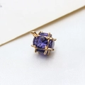 Macro shot of purple faceted zircon cube pendant with gold frame for DIY jewelry - Large / Deep purple