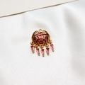Macro shot of gold-plated Ruyi lock pendant with red enamel Fu character and pink crystals - No.01 / Red