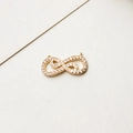 Close-up of infinity shaped gold pendant connector with micro-pave white zircon stones - Style 03 / No.03
