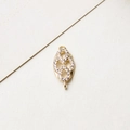 Macro view of gold-plated infinity pendant with pavé zircon settings for DIY jewelry - Style 04 / No.04