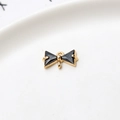 Detailed view of gold bow pendant with black cubic zirconia and dual hanging loops - Black Double Hanging Bowknot (LF2239)