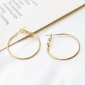 Detail of gold-plated circular hoop earrings with leverback clasp on a silk cloth - 30mm / K Gold