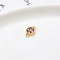 Macro detail of gold-plated flower charm with purple zircon and dual link loops - Light Purple Four Leaf Clover (LF2239)