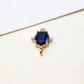 Detailed close-up of oval dark blue gemstone pendant with gold-plated zircons connector - Dark Blue