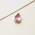 Detail view of pear-shaped gradient glass pendant with gold-plated copper bezel setting - 7*13mm / 05# Gradient