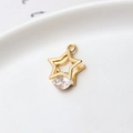 Macro shot of gold star-shaped pendant with oval cubic zirconia and metallic ring hook - 02# Five-pointed Star