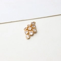 Macro shot of gold-plated brass pendant with sparkling round zircons for DIY jewelry making - Water Drop Cluster Style