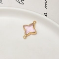 Macro view of gold plated four-pointed star charm with pink stone for DIY jewelry - Light Pink