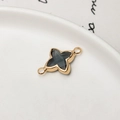 Macro detail of gold-plated clover and star charms with gray stones for DIY jewelry - Dark Gray