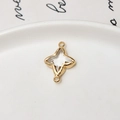 Macro shot of gold-plated four-pointed star pendant connector with clear crystal for DIY - White