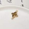 Detailed macro of gold-plated star pendant with smoky brown resin for DIY jewelry - Olive Green