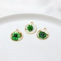 Detail of floral resin charms with gold foil and copper edges for DIY jewelry making - Circle / Green