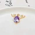 Macro detail of golden deer head pendant with purple teardrop zircon on ceramic plate - Antler Teardrop (02#) / Lavender (02#Lavender)