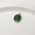 Oval green faceted crystal charm with gold-plated frame for DIY jewelry making - Jelly Dark Green
