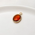 Oval amber birthstone pendant in gold plated setting for DIY jewelry making - Coffee
