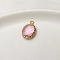 Pink oval faceted crystal birthstone pendant with gold-plated copper frame - Light Pink