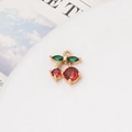 Detailed macro view of cherry pendant with red and green cubic zirconia stones - Red Round Zircon Style (Style-06)