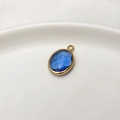Oval dark blue glass birthstone pendant with gold-plated frame for jewelry making - Light Blue