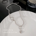 Collana in acciaio al titanio con ciondolo a cuore, catena lunga e dettagli circolari - Argento