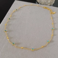 Collana in titanio dorato con perline blu Evil Eye e catena regolabile - Stile Perline Occhio Oro