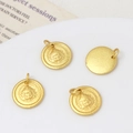 Macro detail of matte gold Buddhist pendants showing relief carvings and frosted textures - 01#12*14mm