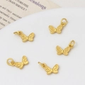 Detailed macro view of 5 matte gold butterfly charms with elegant engraved scroll patterns - 03#7*12mm