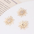 Detailed close-up of three sun-shaped gold pendants with sparkling cubic zirconia centers - 02#16*18 / Sun Gold Style