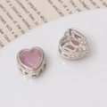 Macro shot of silver heart beads with pink gemstones and hollow-out back for DIY jewelry - Heart Shape / Silver-Pink