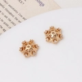 Macro shot of two gold plated snowflake flower bead spacers with zircon stone inlays - Six-Petal Flower Style (04#11*10mm)