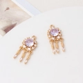 Detailed close-up of dreamcatcher charms with purple zircons and feather tassels - Light Purple