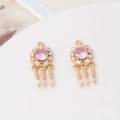 Detail of dreamcatcher charms with pink crystals and zircon feathers for DIY jewelry - Pink