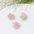 Makroaufnahme von 3D-Blütenknospenperlen mit Farbverlauf für DIY-Haarschmuck - Rosa