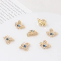 Macro detail of gold plated flower spacer beads with inlaid zircons for DIY jewelry - Gold Flower