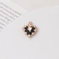 Macro shot of black enamel heart pendant with golden crown frame and sparkling zircons - Black Crown Heart Style (03#14*16mm)