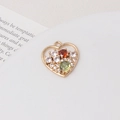 Macro shot of heart-shaped gold-plated pendant with colorful zircon stones and hanging loop - Colorful Heart Style (04#17*18mm)