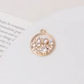 Macro shot of gold circular pendant with pavé zircons on white ceramic plate - Round Micro Pave Style (05#17*20mm)