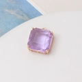 Macro shot of light purple square faceted crystal pendant with gold claw setting - Light Purple