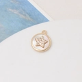 Macro shot of gold-plated circular pendant with white shell inlay and sparkling star detail - 28# Round Five-pointed Star (13*15mm)