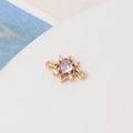 Macro detail of sunburst jewelry connector with purple cubic zirconia and side loops - Light Purple