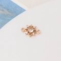 Detail of gold-plated sunburst charm with champagne zircon inlay for DIY jewelry - Light Champagne