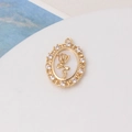 Detailed close-up of oval gold pendant featuring a hollow rose and white zircon accents - Relief Rose Style (02#21*28mm)