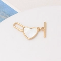 Macro detail of golden heart pendant with white shell inlay and toggle clasp connector - Heart Style (04# 18x30mm)