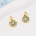 Detail of gold-plated octagonal star charms with cyan enamel and central pearl inlay - 04#White