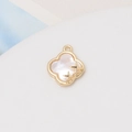 Macro view of gold-plated clover pendant with white shell inlay and star details - 30#12*14mm